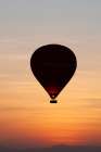 Africa, Egypt, Luxor. Hot air balloons travel over the Valley of the Kings at sunrise. Art Print